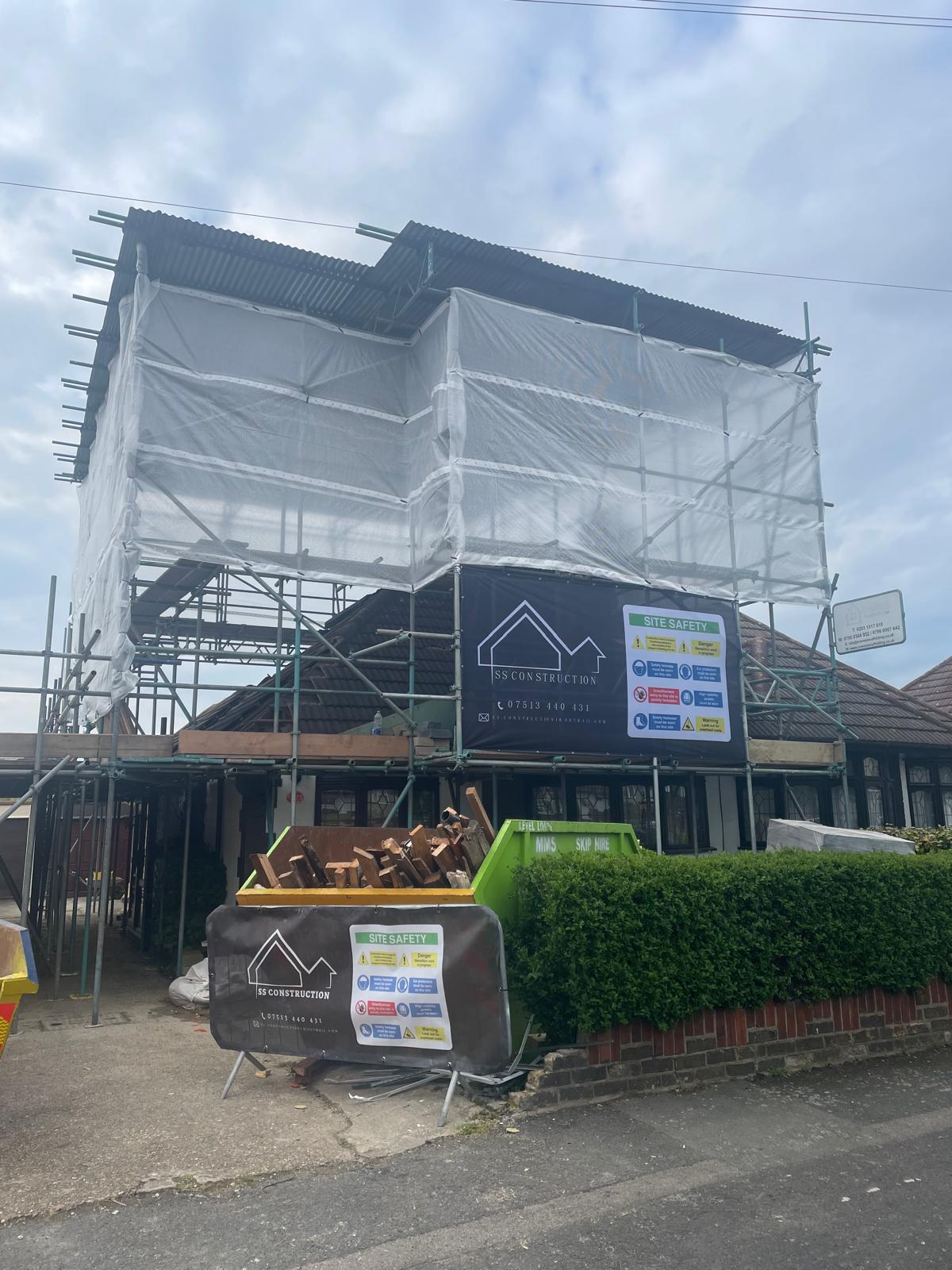 Roofing work with scaffolding