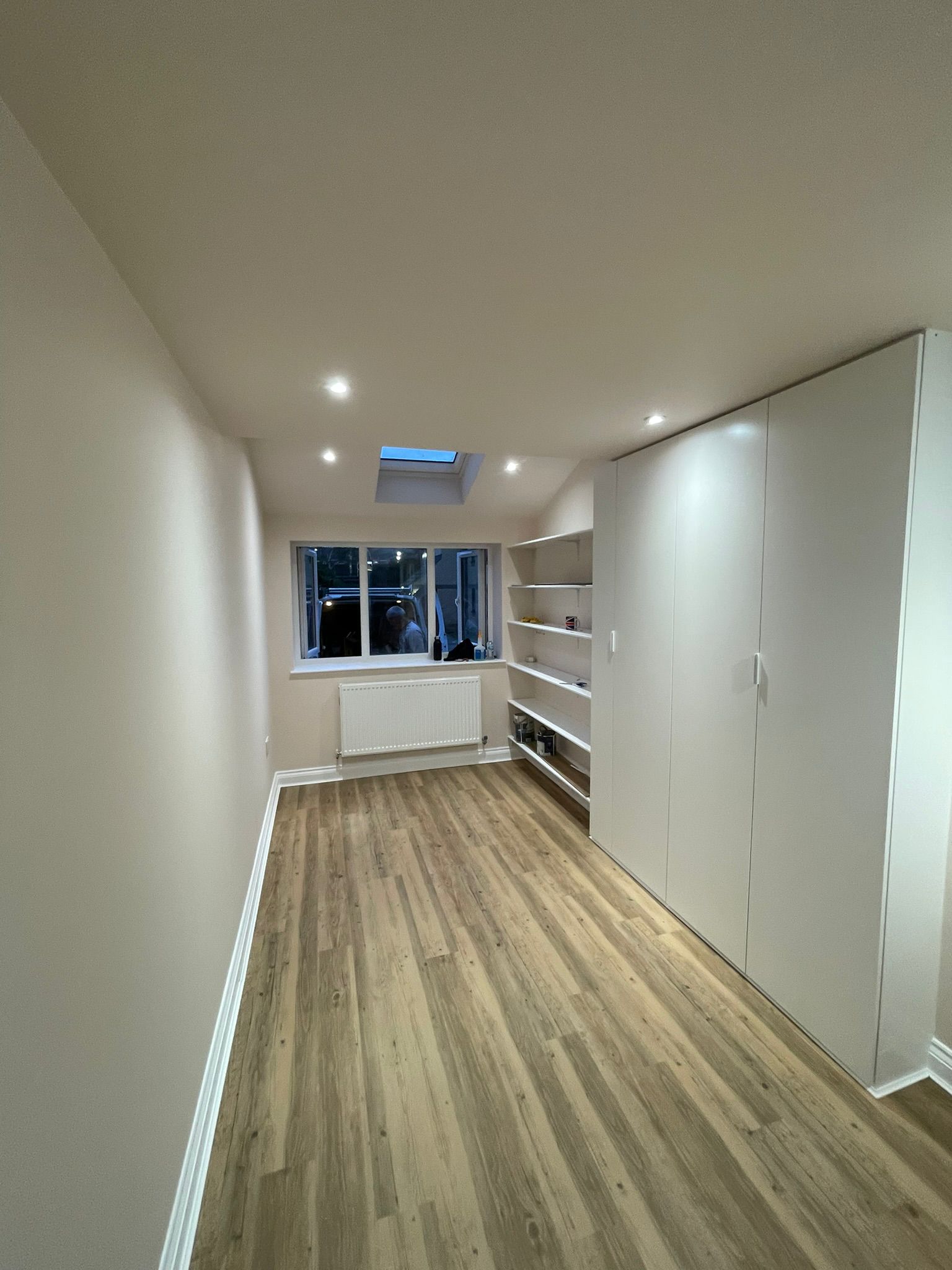 Garage conversion showing before, during, and finished interior